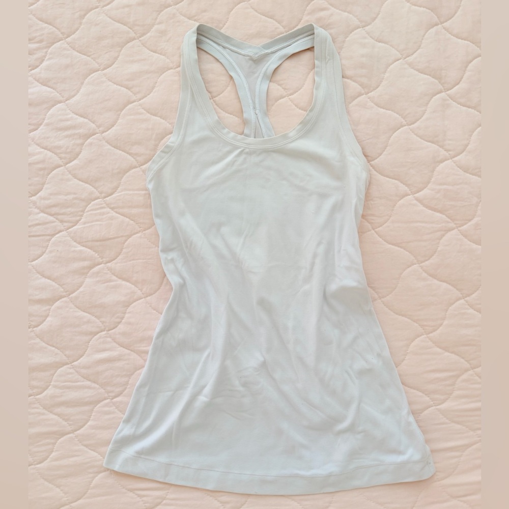 Athletica Cool Racerback Tank, designed for yoga and athletic activities.